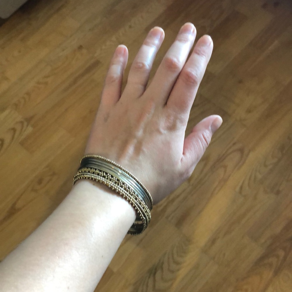 Stack of gold bangle bracelets